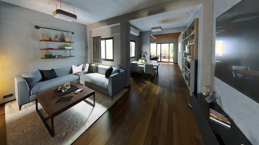 Salón con estantería a medida y luz natural desde el pasillo.