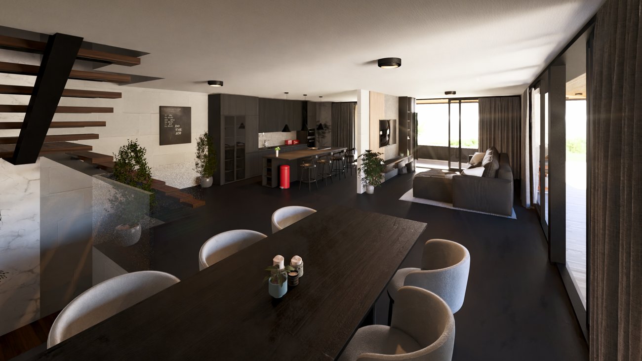 Cocina y salón en planta abierta, con isla central y mesa de comedor.