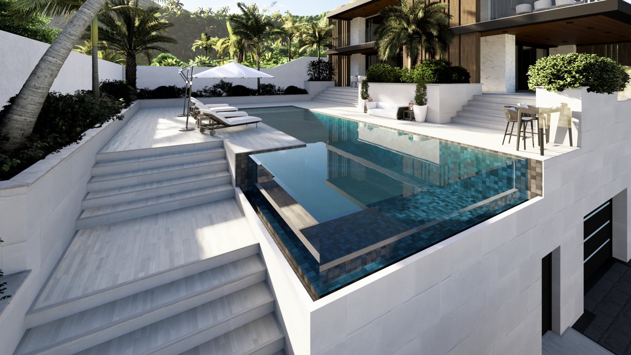 Piscina de borde infinito, con la vivienda reflejada en el agua.